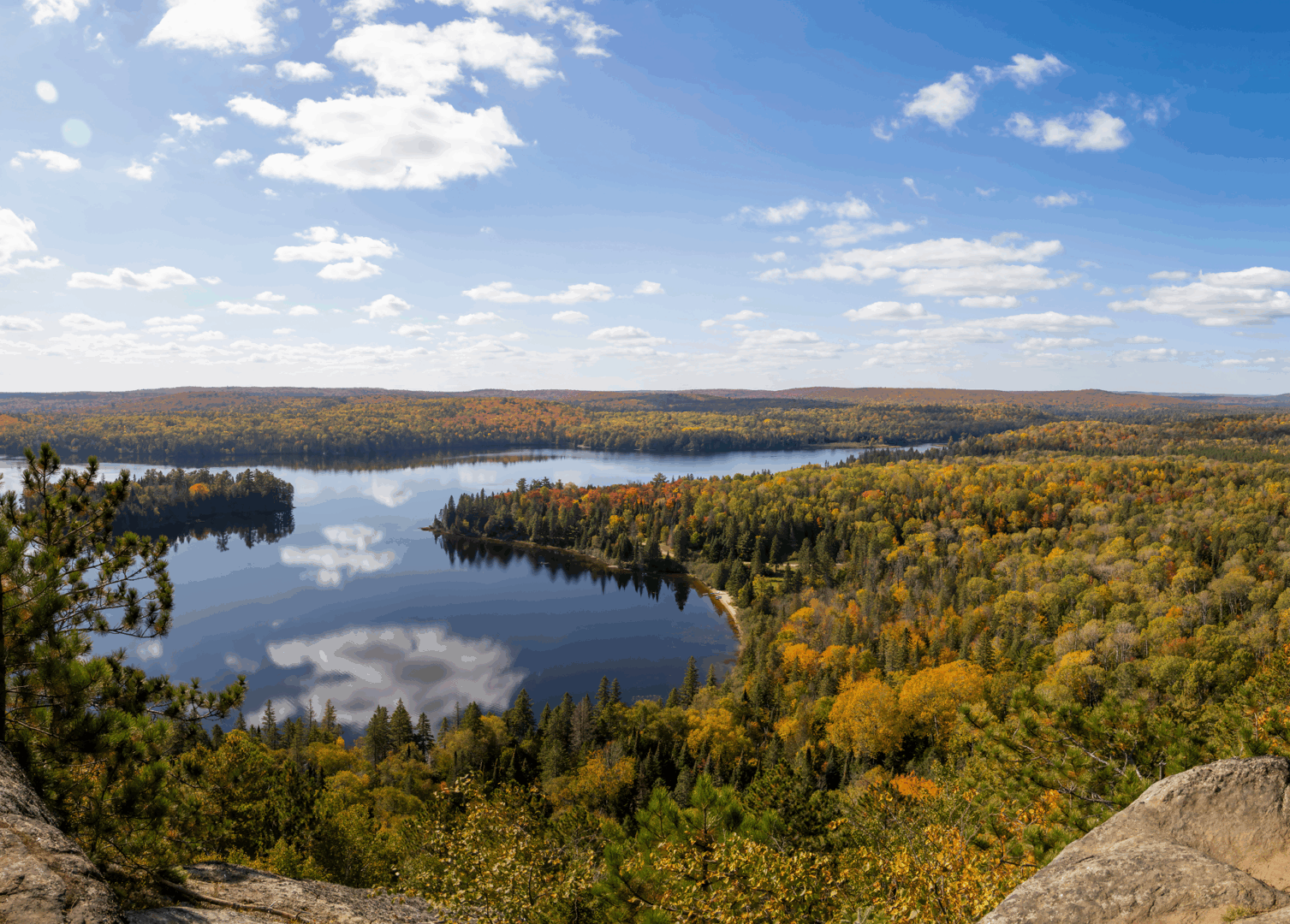 Scenic lake view with autumn trees.